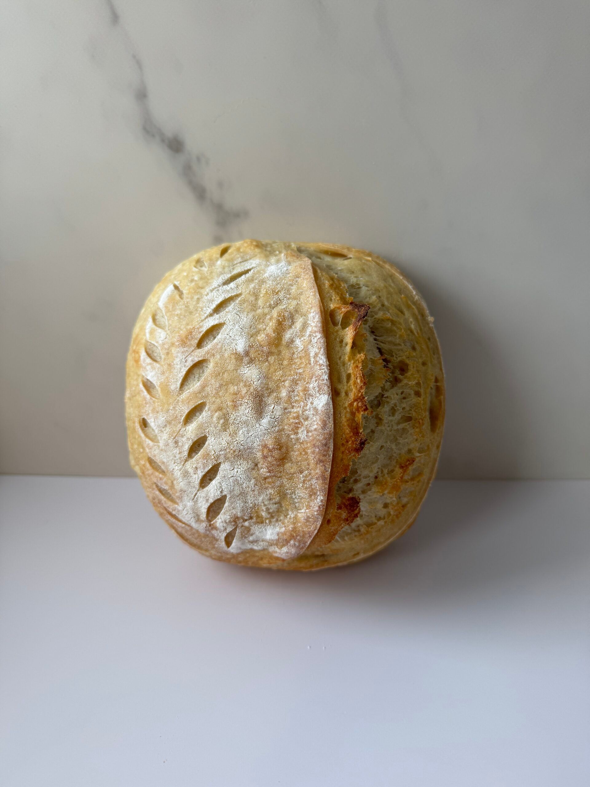 Half loaf of plain sourdough batard